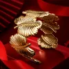 A golden feather-shaped bracelet is a fashionable and light luxury wrist accessory for ladies Specification image